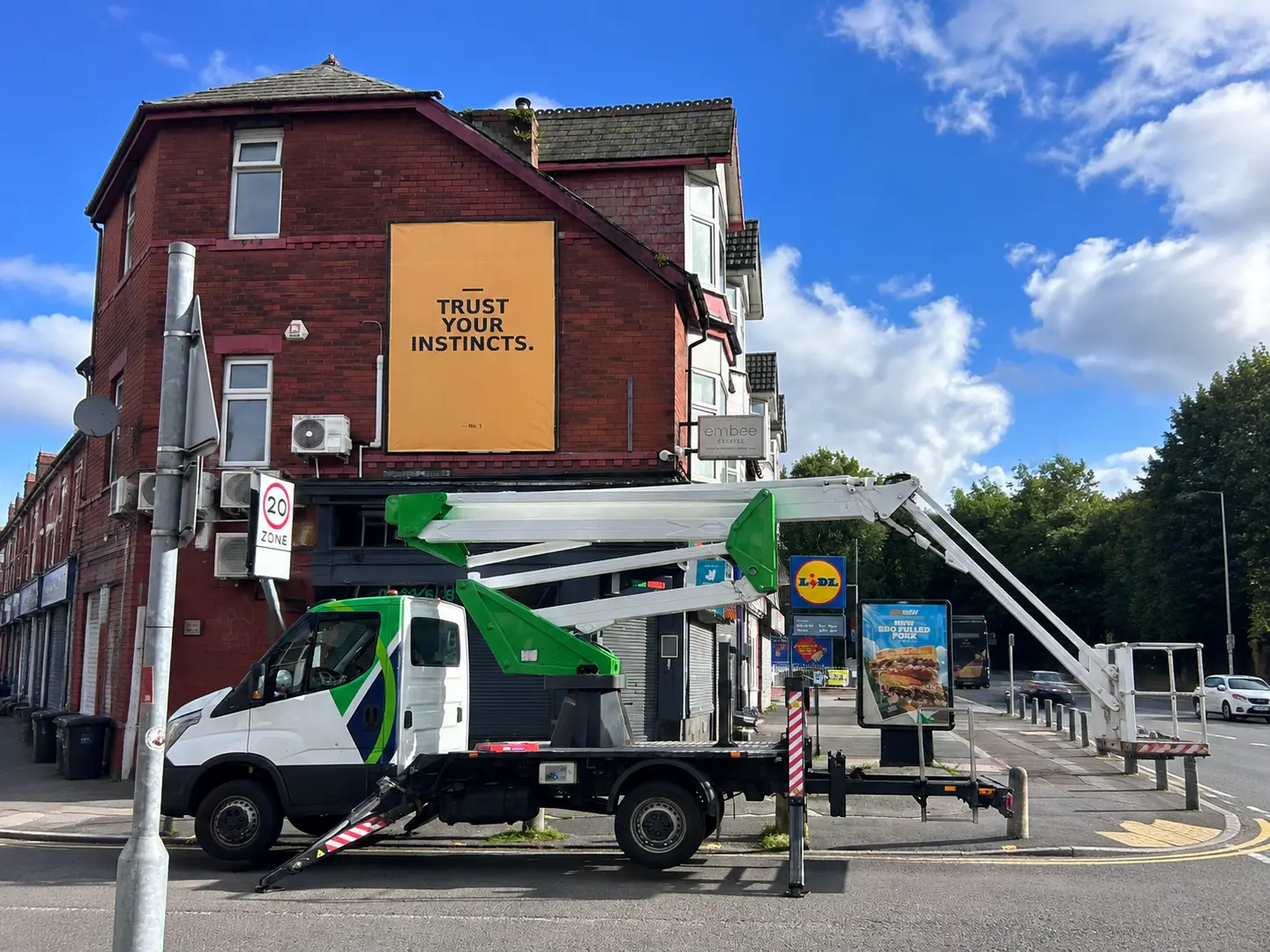 Wall mounted outdoor billboard installation at Bury New Road Prestwich Manchester